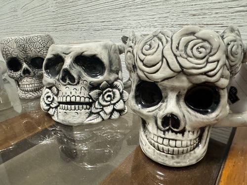 Set of (4) Ceramic skulls coffee mugs